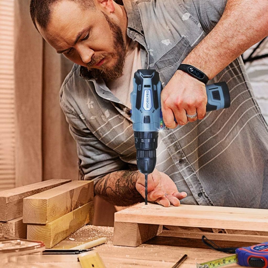 man using WORKPRO W004548A Cordless Drill