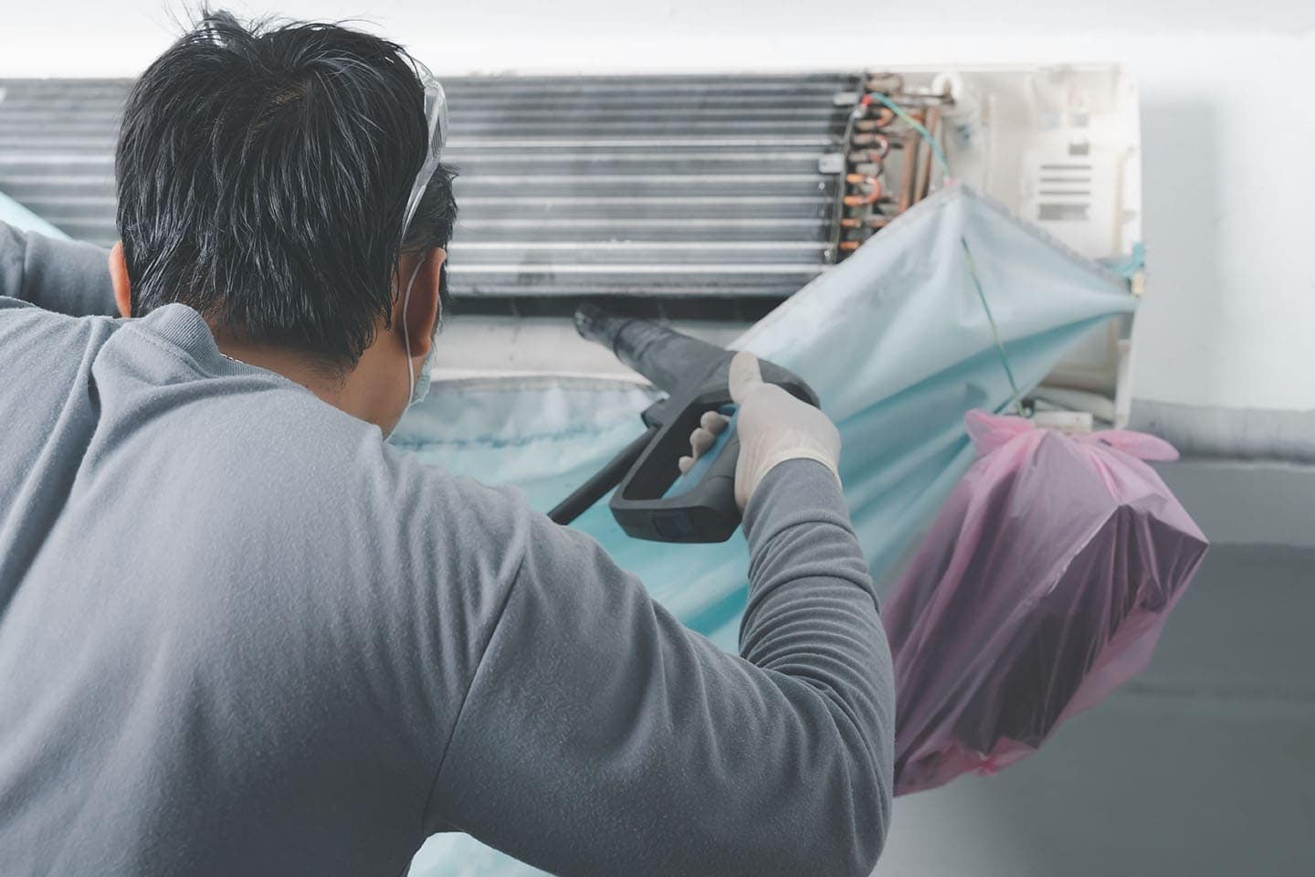 man using air compressor for cleaning