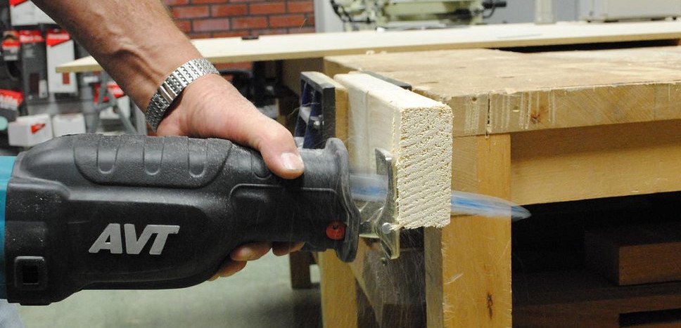 man using reciprocating saw
