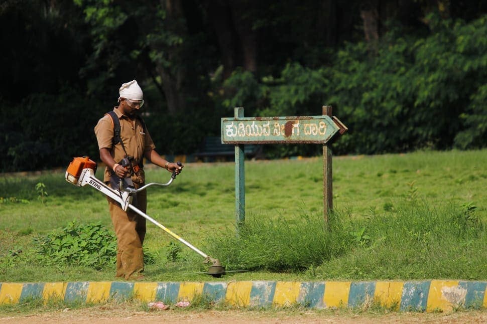 man using string trimmer