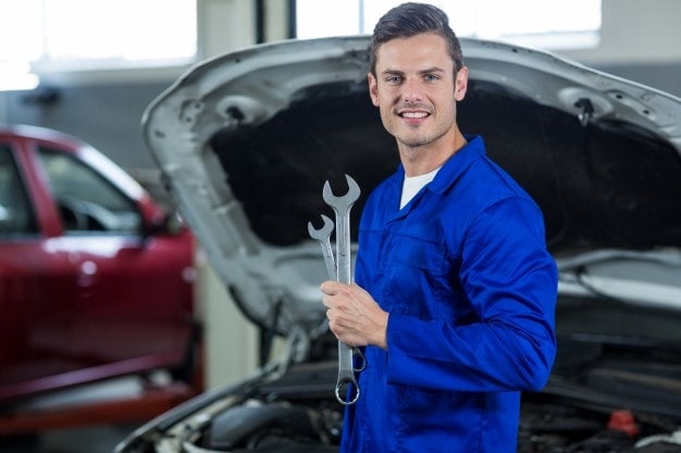 mechanic holding a wrench