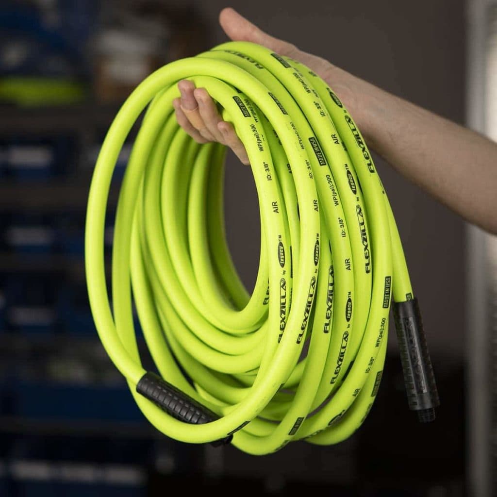person holding Flexzilla HFZ3850YW2 Air Hose