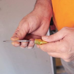 person holding Klein Tools 4-in-1 Electronics Pocket Screwdriver