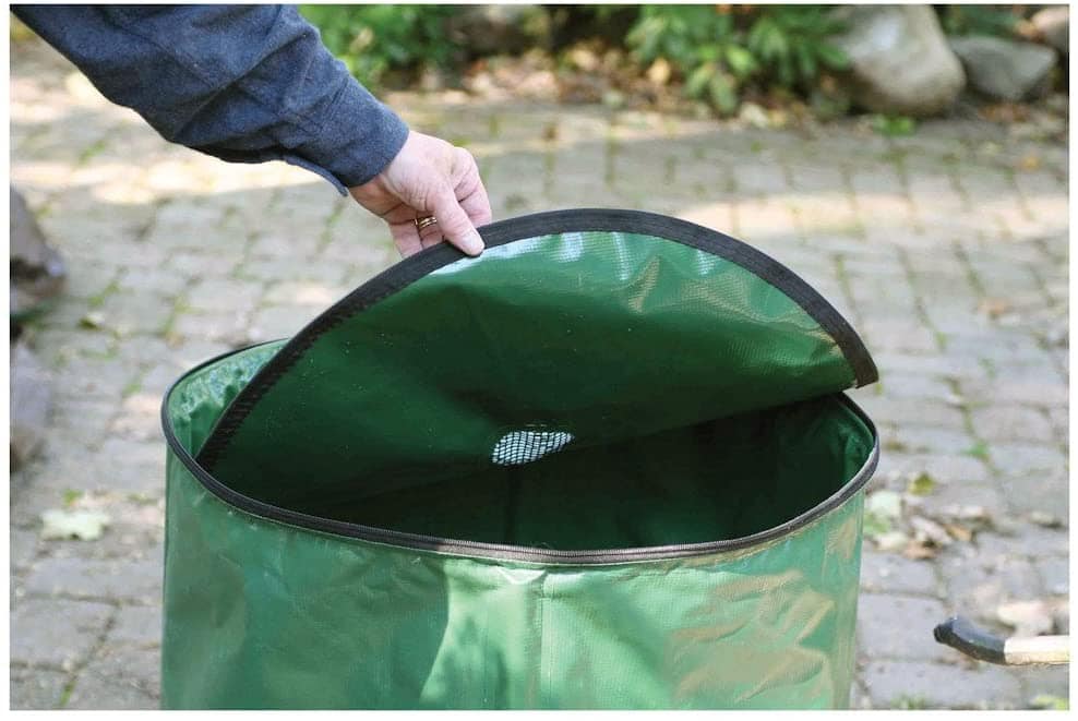 person holding the cover of Etna 50-Gallon Portable Rain Barrel