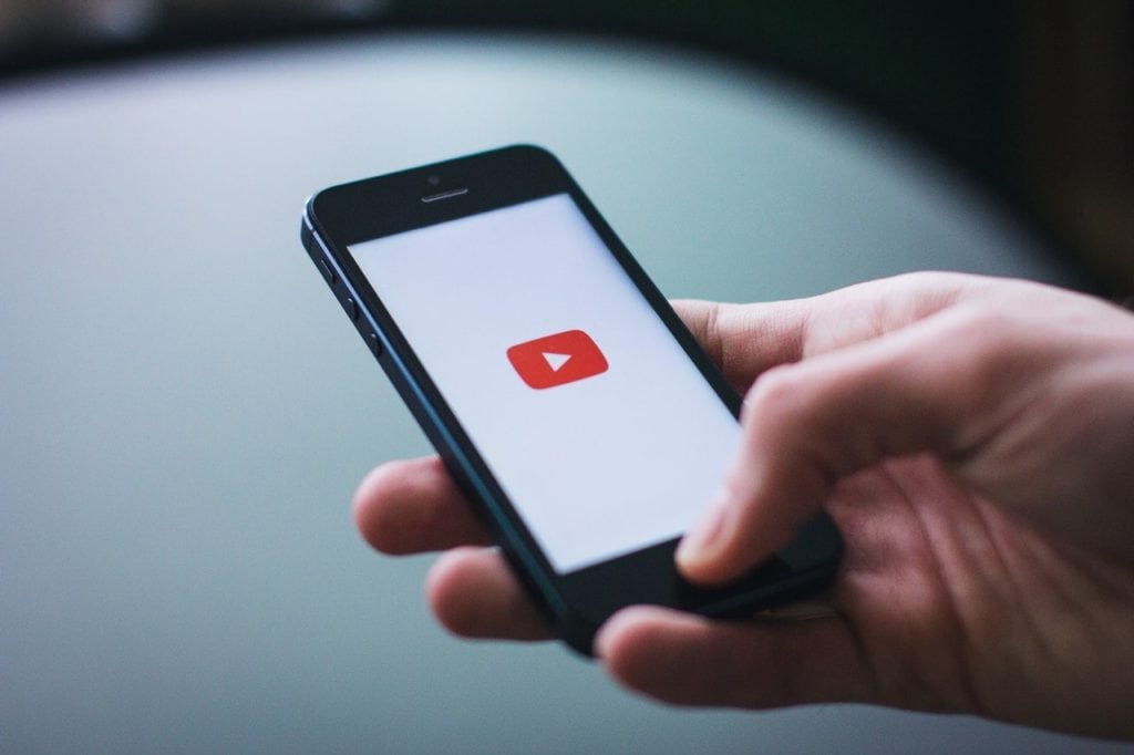 person opened Youtube app on smartphone