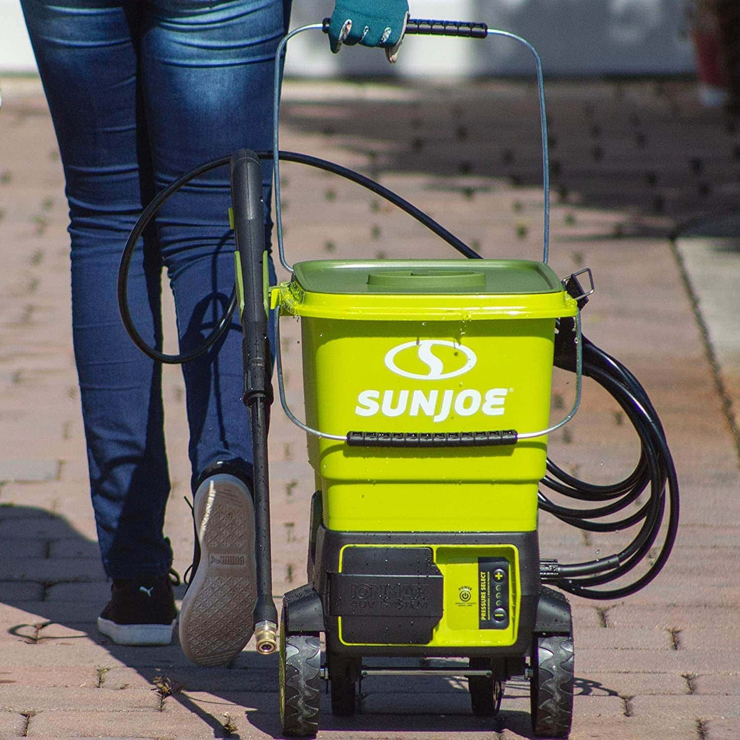 person pulling Sun Joe SPX6001C-XR 1160 Cordless Pressure Washer