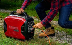 person using A-iPower SUA2000iV Portable Inverter Generator