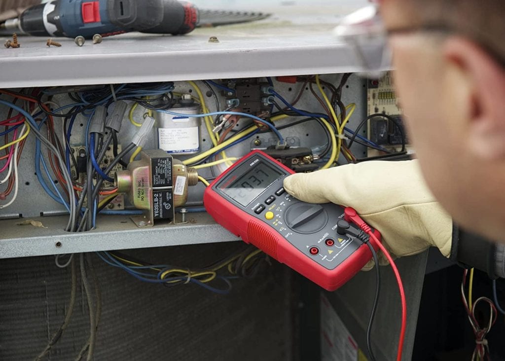 person using Amprobe AM-520 HVAC Multimeter