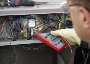 person using Amprobe AM-520 HVAC Multimeter