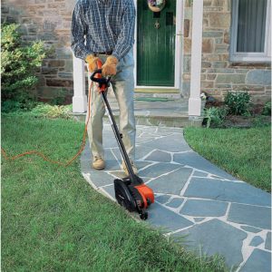 person using BLACK+DECKER 2-in-1 Landscape Edger