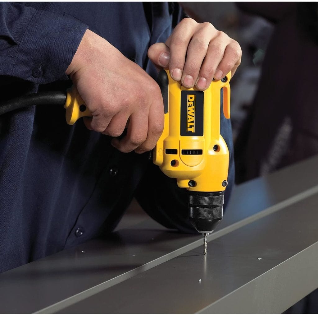person using DEWALT Corded Drill