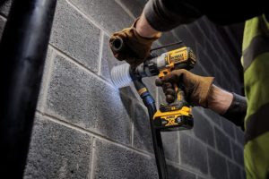 person using DEWALT DCD996B XR Hammer Drill