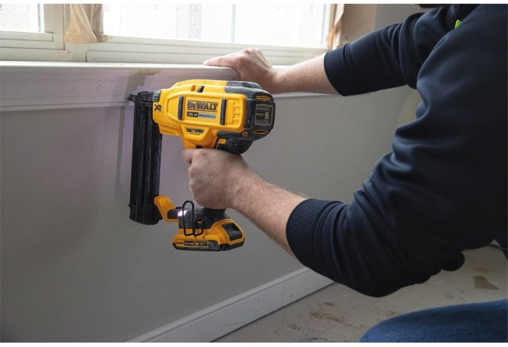 person using DEWALT DCN680D1 Cordless Brad Nailer