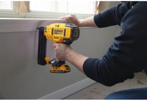 person using DEWALT DCN680D1 Cordless Brad Nailer