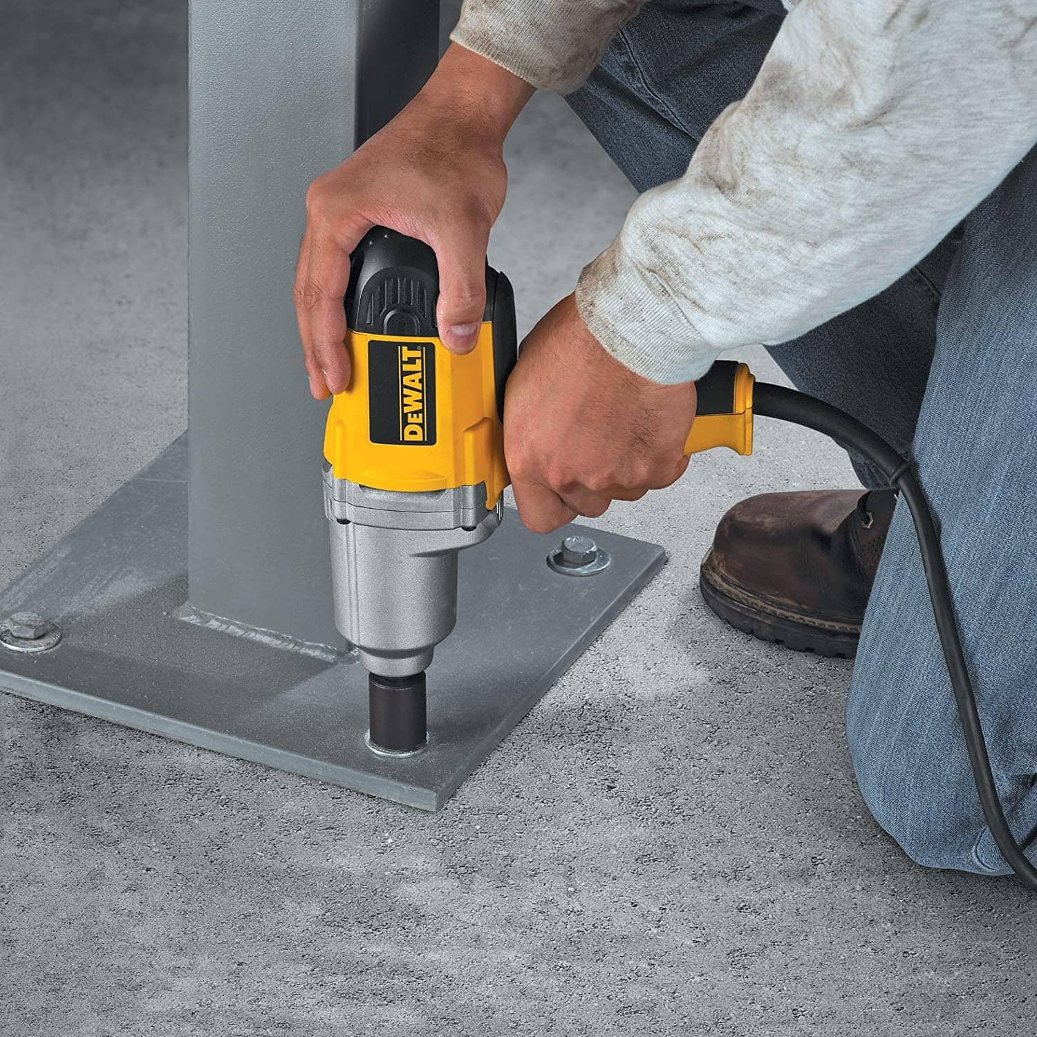 person using DEWALT DW292 Corded Impact Wrench