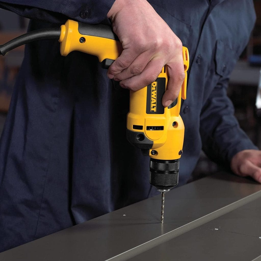 person using DEWALT DWD112 VSR Electric Drill