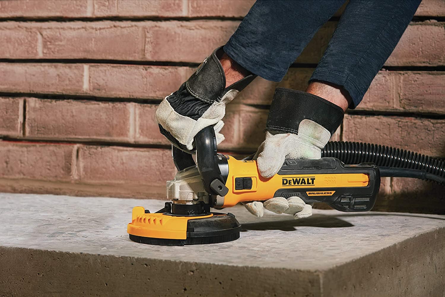person using DEWALT DWE46253 Concrete Surface Grinder