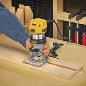 person using DEWALT DWP611 Router