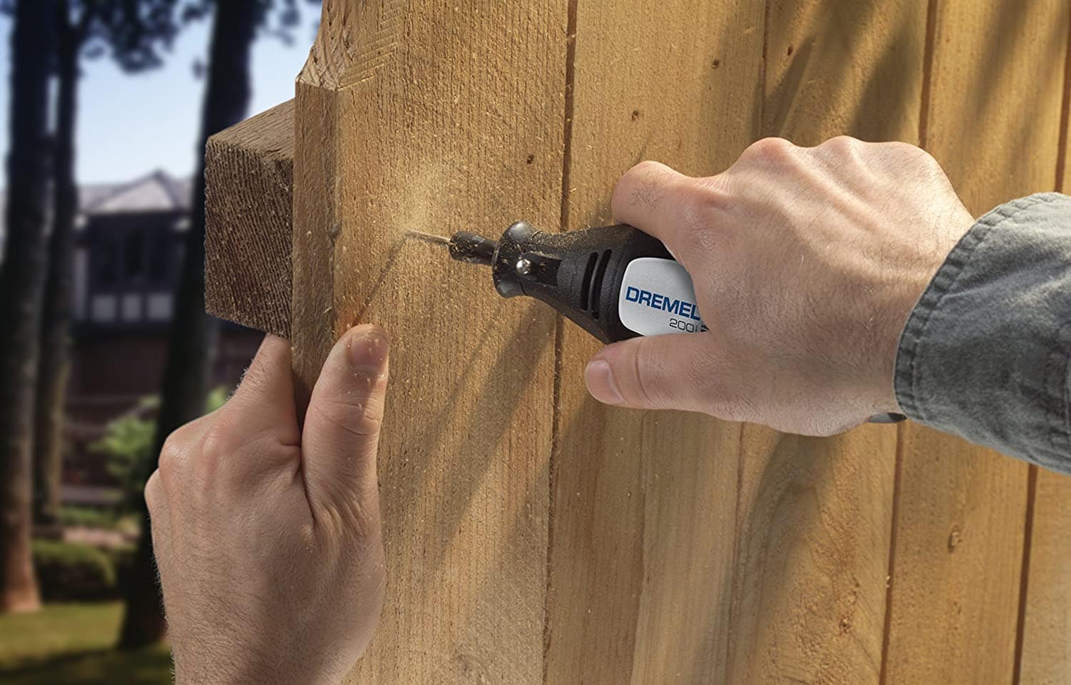 person using Dremel 200