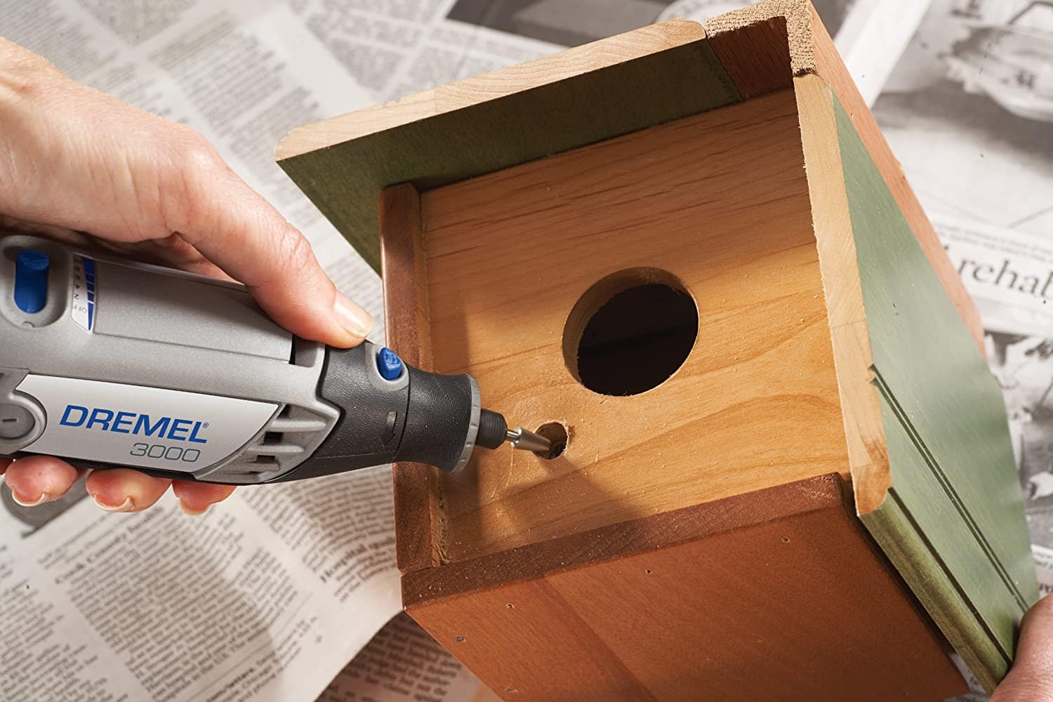 person using Dremel 3000