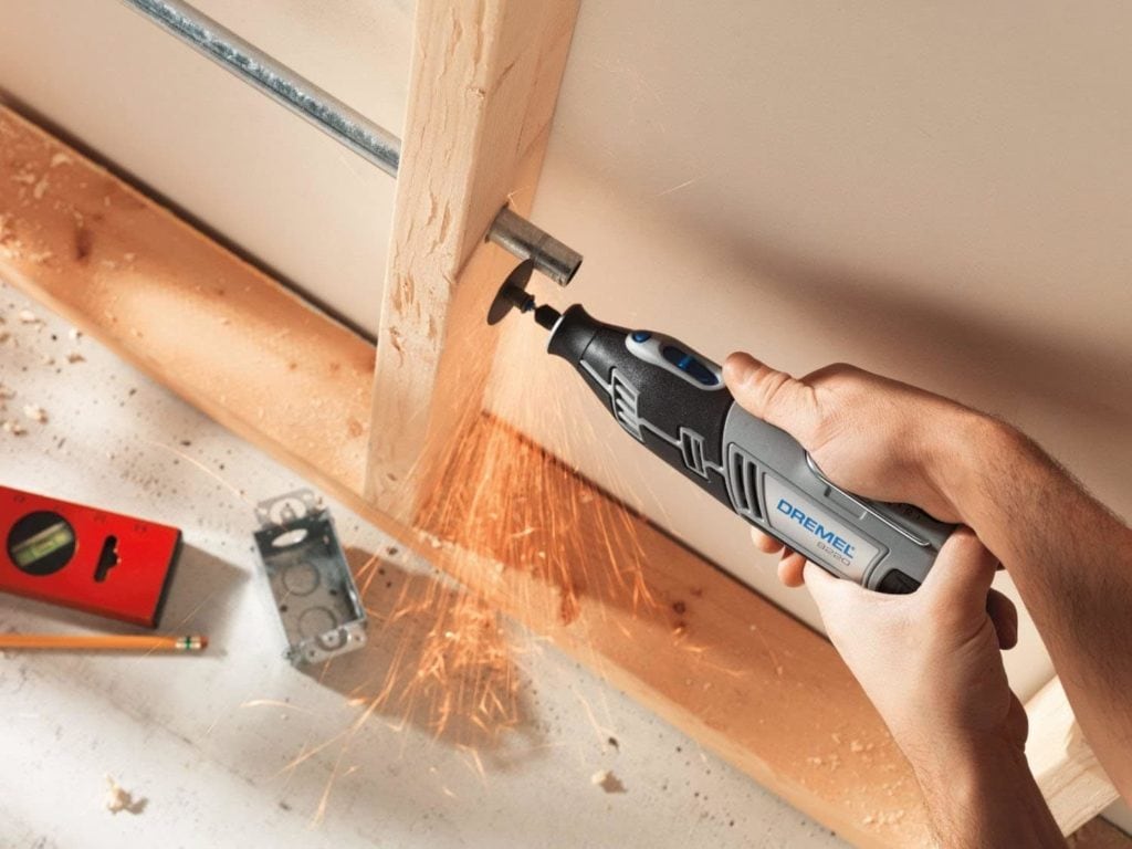 person using Dremel 8220-1:28 Cordless Rotary Tool