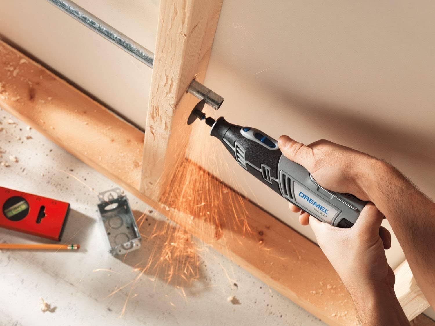 person using Dremel 8220-1:28 Cordless Rotary Tool