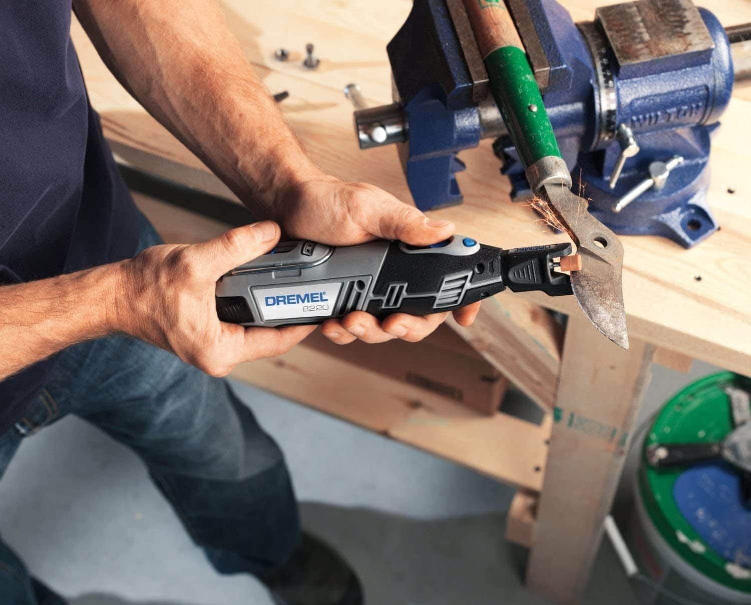 person using Dremel 8220
