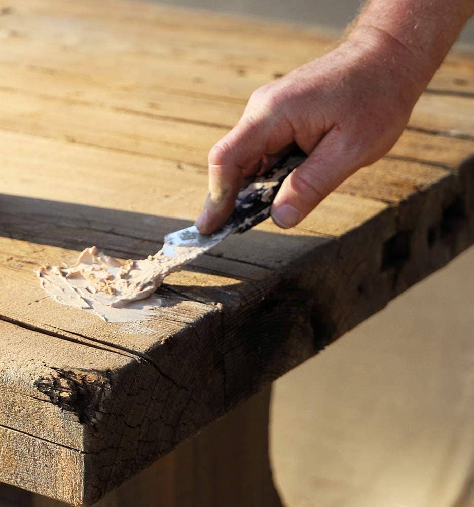 person using FamoWood 40022126 Latex Wood Filler