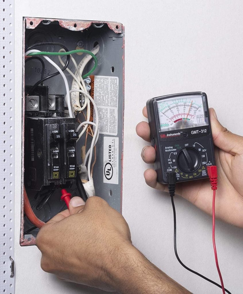 person using Gardner Bender Analog Multimeter