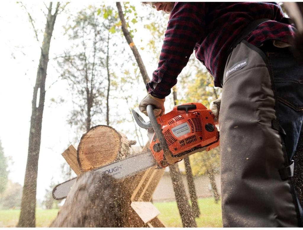 person using Husqvarna 455