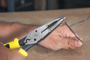 person using Klein Tools J207-8CR Needle Nose Pliers