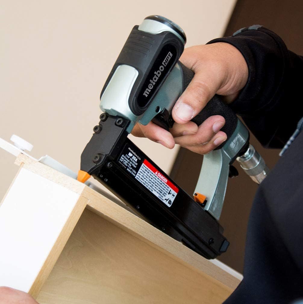 person using Metabo HPT NP35A Pin Nailer