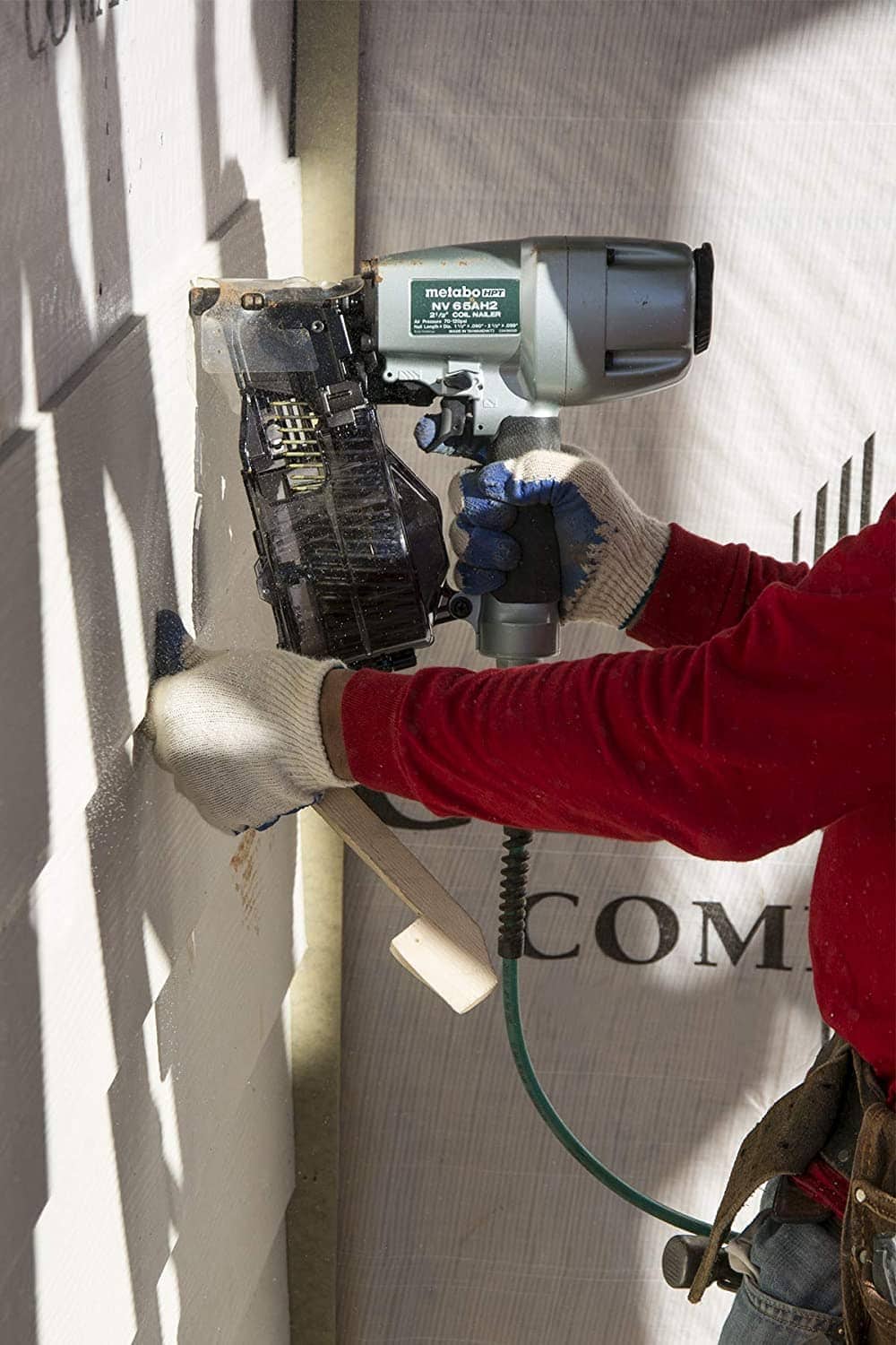 person using Metabo NV65AH2 HPT Coil Siding Nailer