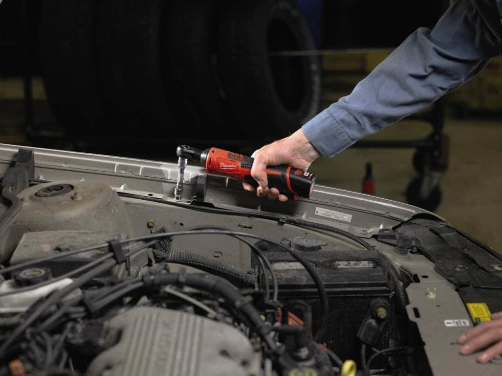 person using Milwaukee 2457-21 Cordless Ratchet