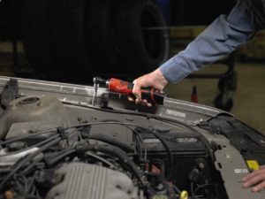 person using Milwaukee 2457-21 Cordless Ratchet