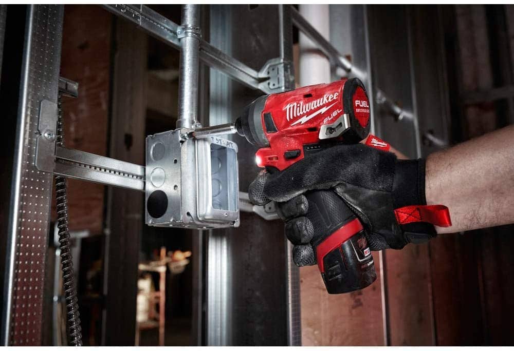 person using Milwaukee Electric Tools 2598-22 M12 Fuel Hammer Drill
