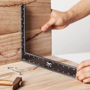 person using Mr. Pen- Carpenter Framing Square