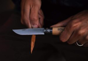 person using Opinel Stainless Steel Folding Knife