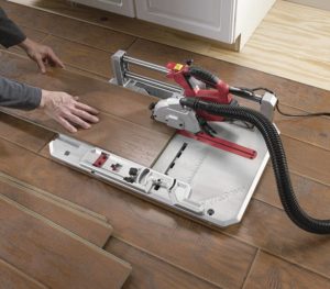 person using SKIL 3601-02 Laminate Flooring Saw