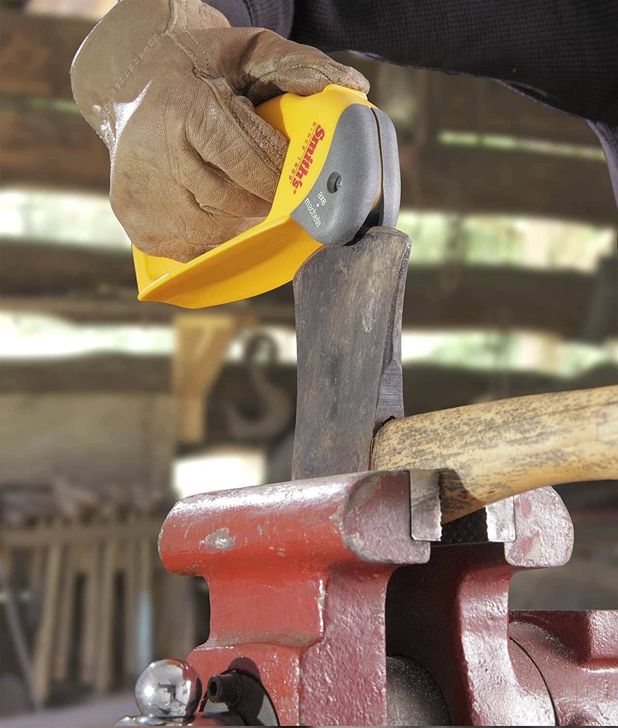 person using Smith's 50582 Axe Sharpener