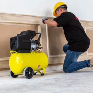 person using Stark 65151 Portable Quiet Air Compressor