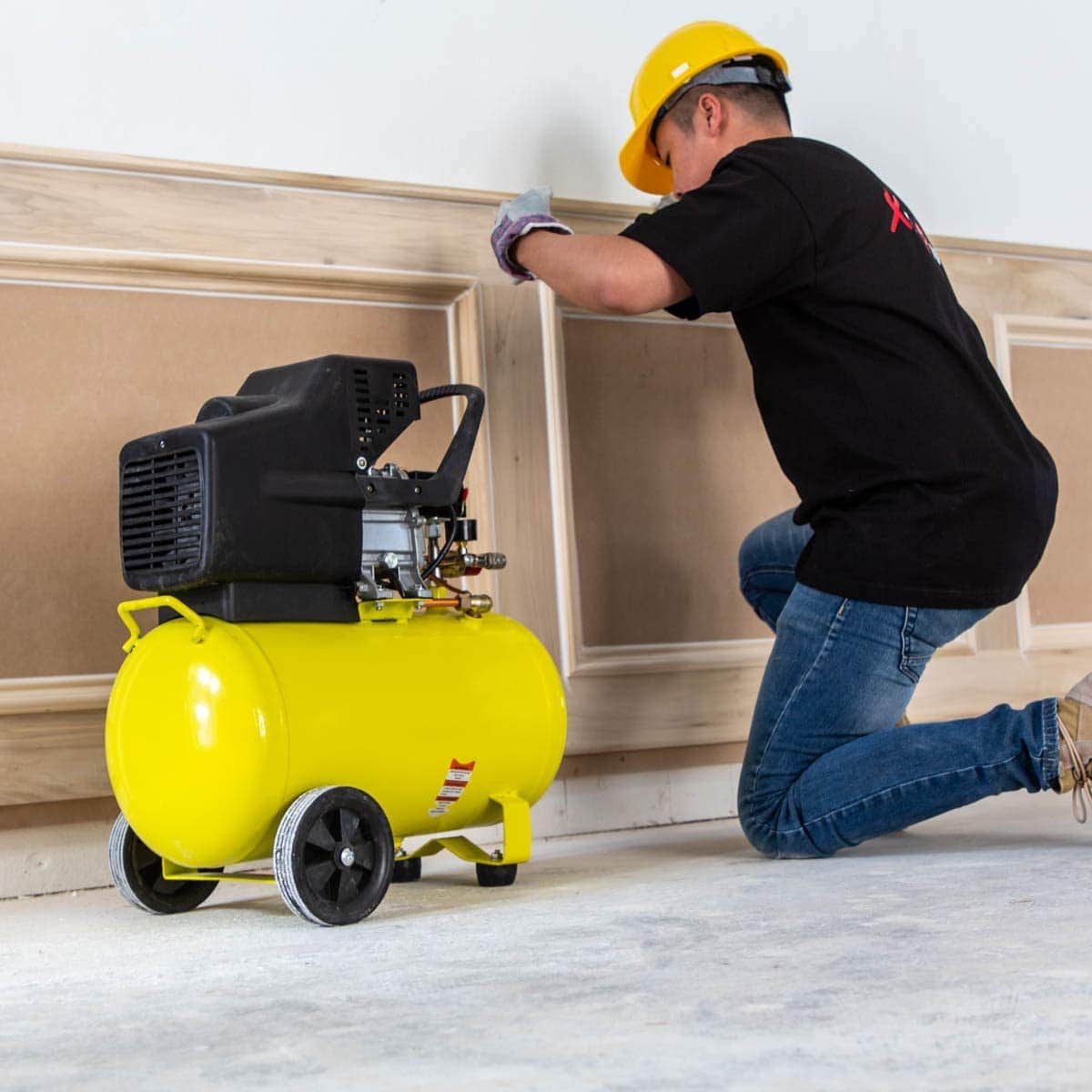 person using Stark 65151 Portable Quiet Air Compressor