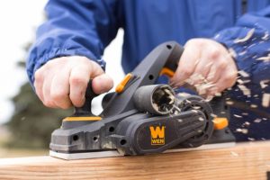 person using WEN 6530 Electric Hand Planer