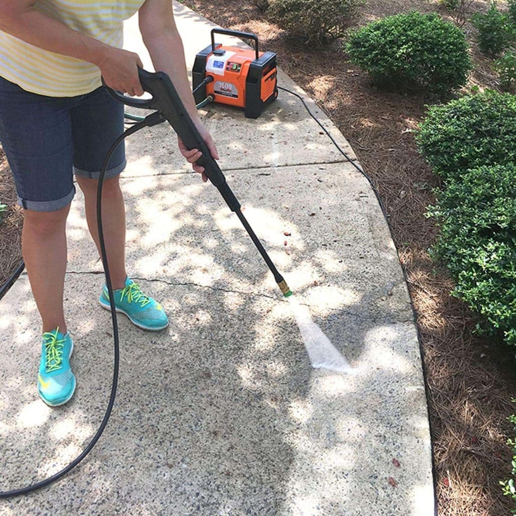 person using YARD FORCE YF1600A1 Electric Pressure Washer