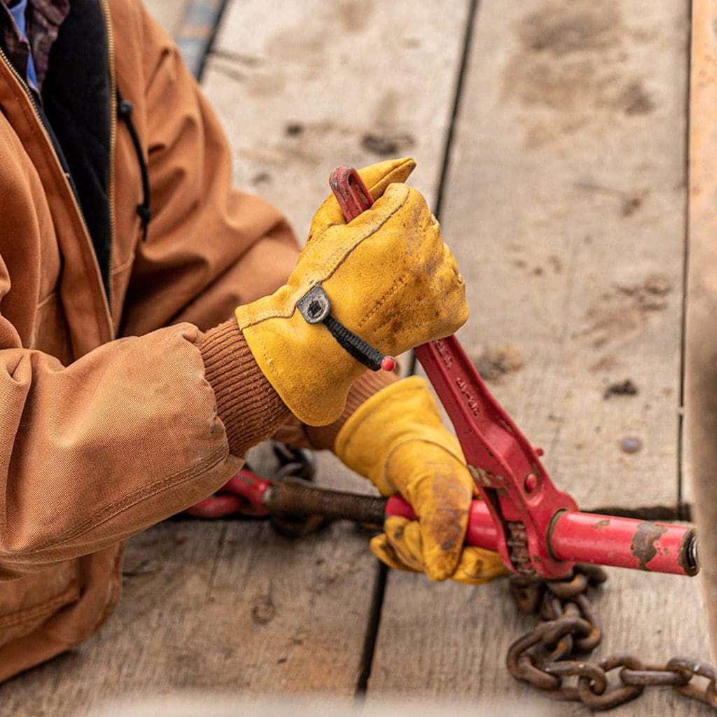 person wearing Wells Lamont 1132L Men's Leather Work Gloves