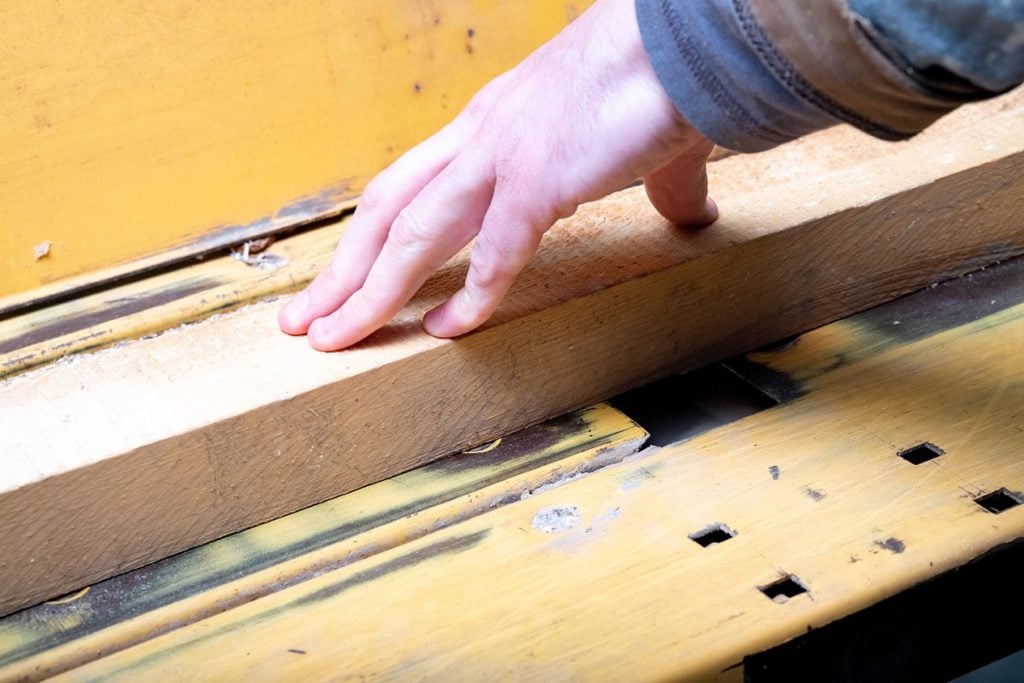 person working on a jointer