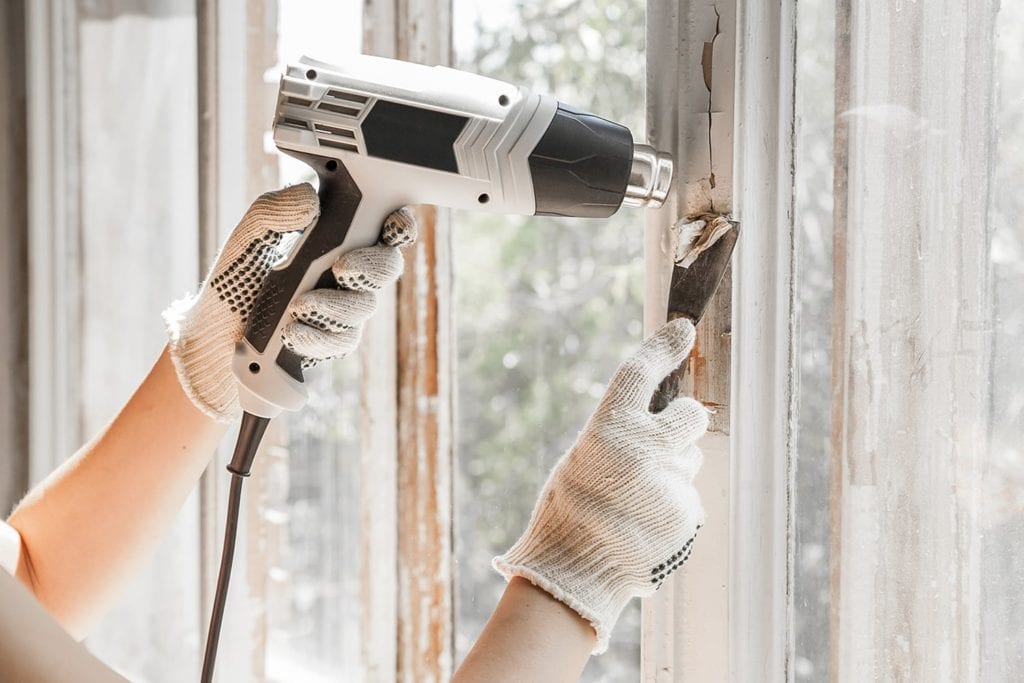 removing paint using heat gun and scraper
