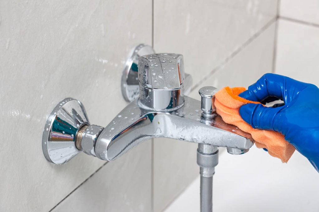 removing soap scum on metal faucet
