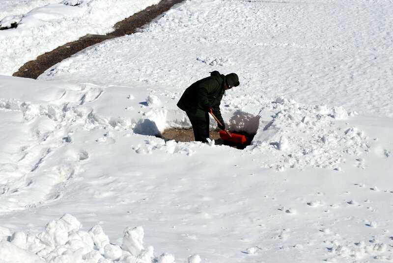 man shoveling snow