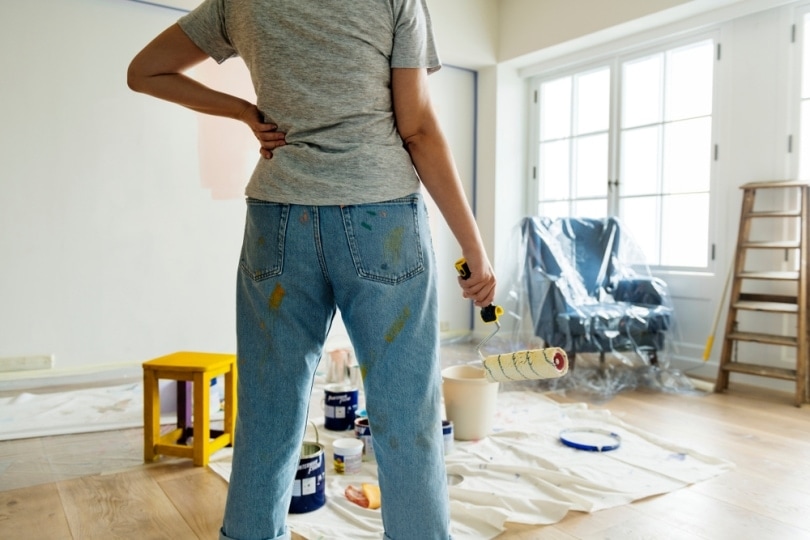 rubber gloves applies a glossy white paint finish_Whiteaster_shutterstock